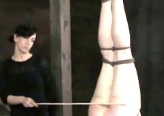 Lezdom spanking a suspended bondage hoe