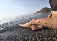 Polka dot tights on the beach